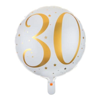 Un ballon en aluminium de 35 cm de diamètre fond blanc avec l'inscription 30 et des étoiles coloris or pailletés pour un déco de fête d'anniversaire 18 ans.