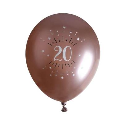 6 Ballons anniversaire en latex de 30 cm, fond rose gold avec le chiffre 20 entouré de points et étoiles coloris blanc.