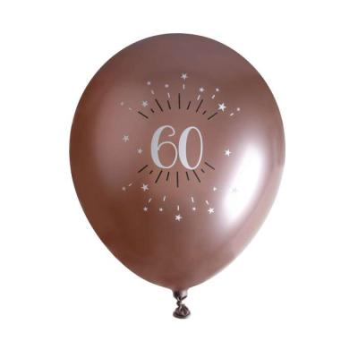 6 Ballons anniversaire en latex de 30 cm, fond rose gold avec le chiffre 60 entouré de points et étoiles coloris blanc.