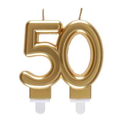 Une bougie d'anniversaire 50 ans coloris  Or formant le chiffre 50 à piquer sur le gâteau.