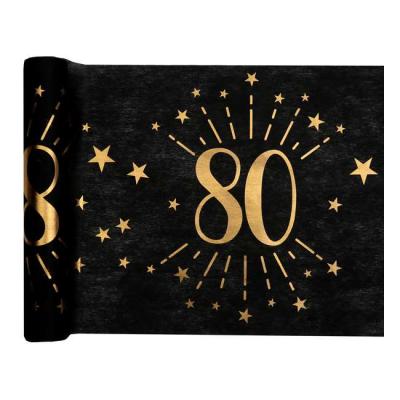 5 Mètres chemin de table anniversaire 80 ans en intissé, fond noir, impression du chiffre 80 et d'étoiles coloris or métallisé.