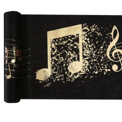 5 Mètres de chemin de table fond noir décor coloris or métallisé représentant des notes de musique sur une partition.