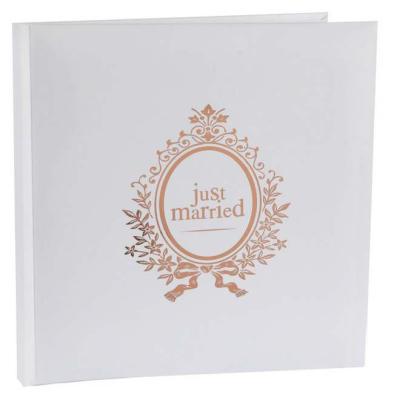 Un livre d'or mariage, couverture en carton épais blanc, portant l'inscription Just Married coloris rose gold métallisé