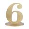 En bois coloris or, le chiffre 6 posé sur son  support à utiliser comme marque table ou en déco de table anniversaire.