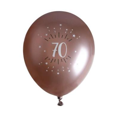 6 Ballons anniversaire en latex de 30 cm, fond rose gold avec le chiffre70 entouré de points et étoiles coloris blanc.