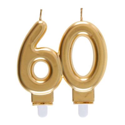 Une bougie d'anniversaire 60 ans coloris  Or formant le chiffre 60 à piquer sur le gâteau.