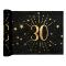 5 Mètres chemin de table anniversaire 30 ans en intissé, fond noir, impression du chiffre 30 et d'étoiles coloris or métallisé.